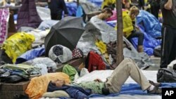 Nathan Hendrix of Austin, Texas, lies on a mattress in Zuccotti Park during a demonstration by the Occupy Wall Street campaign near the financial district of New York, September 29, 2011.