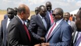 South Sudan's ex-vice President and former rebel leader Riek Machar is received as he arrives at the Juba International Airport, in Juba, South Sudan, Feb. 17, 2020. 