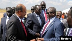 South Sudan's ex-vice President and former rebel leader Riek Machar is received as he arrives at the Juba International Airport, in Juba, South Sudan, Feb. 17, 2020. 
