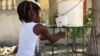 Haiti Teen Invents Hands-free Bucket Faucet