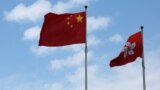 A Chinese national flag and a Hong Kong flag fly outside the Legislative Council in Hong Kong, China November 7, 2016, as China's parliament passed an interpretation of Hong Kong's Basic Law on Monday that says lawmakers must swear allegiance to the city 