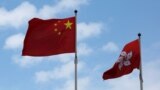 A Chinese national flag and a Hong Kong flag fly outside the Legislative Council in Hong Kong, China November 7, 2016, as China's parliament passed an interpretation of Hong Kong's Basic Law on Monday that says lawmakers must swear allegiance to the city 