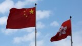 A Chinese national flag and a Hong Kong flag fly outside the Legislative Council in Hong Kong, China November 7, 2016, as China's parliament passed an interpretation of Hong Kong's Basic Law on Monday that says lawmakers must swear allegiance to the city 