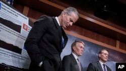 From left, Senate Majority Leader John Thune, R-S.D., Sen. James Lankford, R-Okla., and Sen. Ted Budd, R-N.C., talk about the Laken Riley Act, a bill to detain unauthorized immigrants accused of certain crimes, in Washington, Jan. 9, 2025.