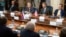 Top from left: a member of the Senate of the legislative Assembly of the state of Texas Peter Hettler, Texas Sen. Don Huffines, Sen. Rand Paul and his communications director Sergio Gor attend a meeting with Russian lawmakers in Moscow, Aug. 6, 2018. 