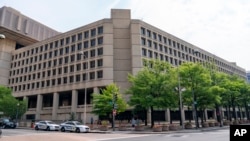 The J. Edgar Hoover FBI Building is seen Friday, June 9, 2023, in Washington. The Trump administration said it has identified 443 federal properties that could be sold off, including the Hoover Building. 