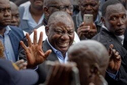 FILE - President Cyril Ramaphosa greets supporters in Soweto, Johannesburg, South Africa, May 8, 2019.