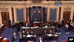 This handout video image shows former Senate Majority Leader Bob Dole, right, in the Senate Chamber on Capitol Hill, Dec. 4,2012, by his wife Elizabeth Dole. Frail and in a wheelchair, Dole was a startling presence on the Senate floor as lawmakers voted on a treaty on disabilities.