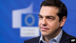 Greece's Prime Minister Alexis Tsipras addresses the media at the European Commission headquarters in Brussels, March 13, 2015. 