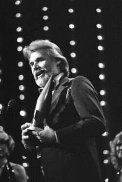 FILE - Kenny Rogers was selected male vocalist of the year at the 13th annual Country Music Association Awards in Nashville, Oct. 8, 1979. He also won single of the year for “The Gambler” and teamed with Dottle West as duo of the year.