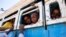 Refugees who fled the conflict in Ethiopia's Tigray region ride a bus going to the Village 8 temporary shelter, near the Sudan-Ethiopia border, in Hamdayet, eastern Sudan, Dec. 1, 2020. 
