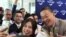 A Chinese tourist takes selfie with Thailand's Prime Minister Srettha Thavisin, during a welcome ceremony of the first batch of Chinese tourists under a five-month visa-free entry scheme at Bangkok’s International Airport, September 25, 2023.(REUTERS/Athit Perawongmetha)