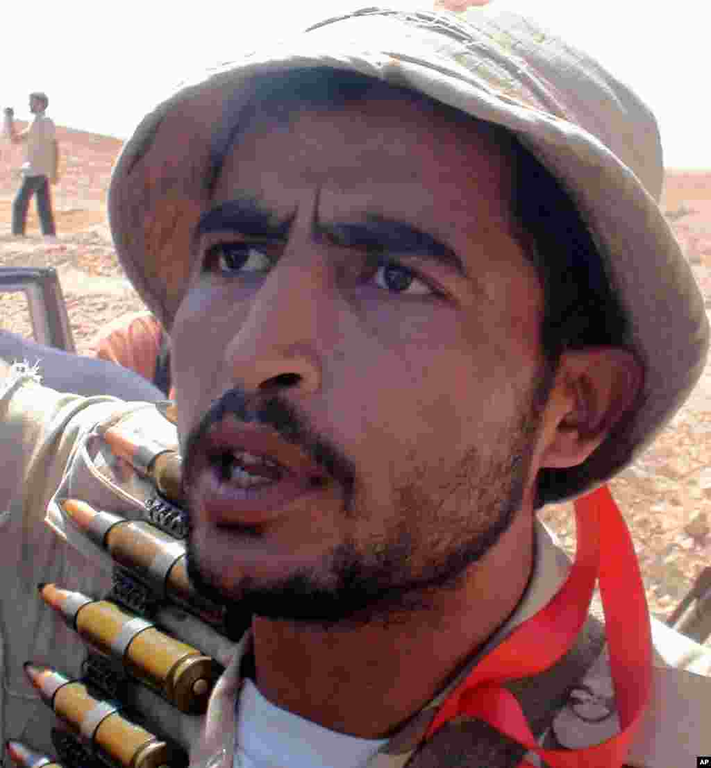 An NTC fighter outside Bani Walid, Libya vows to capture ex-leader Moammar Gadhafi, September 10, 2011. - E. Arrott