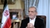 FILE - In this photo released by the Iranian Presidency Office, President Masoud Pezeshkian speaks in a live televised interview by state TV, at his office in Tehran, Iran, Aug. 31, 2024. 