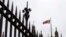 File - The Union flag flies above Parliament in London, Friday, Sept. 26, 2014. 