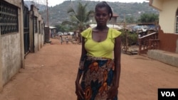 Isatu Gbankay, six months pregnant, stands outside a friend's home in Freetown, Sierra Leone, April 8, 2015. (Nina deVries/VOA)