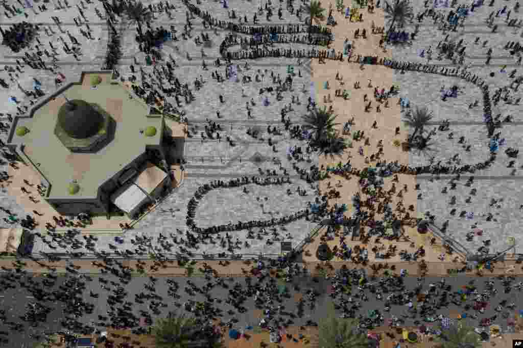 In this aerial photo, pilgrims from the Mouride Brotherhood arrive at the Grand Mosque of Touba during the celebrations of the Grand Magal of Touba, in Senegal, Oct. 6, 2020.