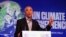 Former US President Barack Obama gestures as he speaks during the COP26 U.N. Climate Summit in Glasgow, Scotland, Nov. 8, 2021,