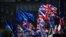 EU and Union flags flap outside the Houses of Parliament in London, Monday, Oct. 28, 2019. European Council president Donald Tusk says the bloc has agreed to grant Britain a new Brexit delay to Jan. 31 next year. 