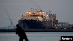 FILE - A liquefied natural gas (LNG) tanker is moored at a thermal power station in Futtsu, east of Tokyo, Feb. 8, 2017. 