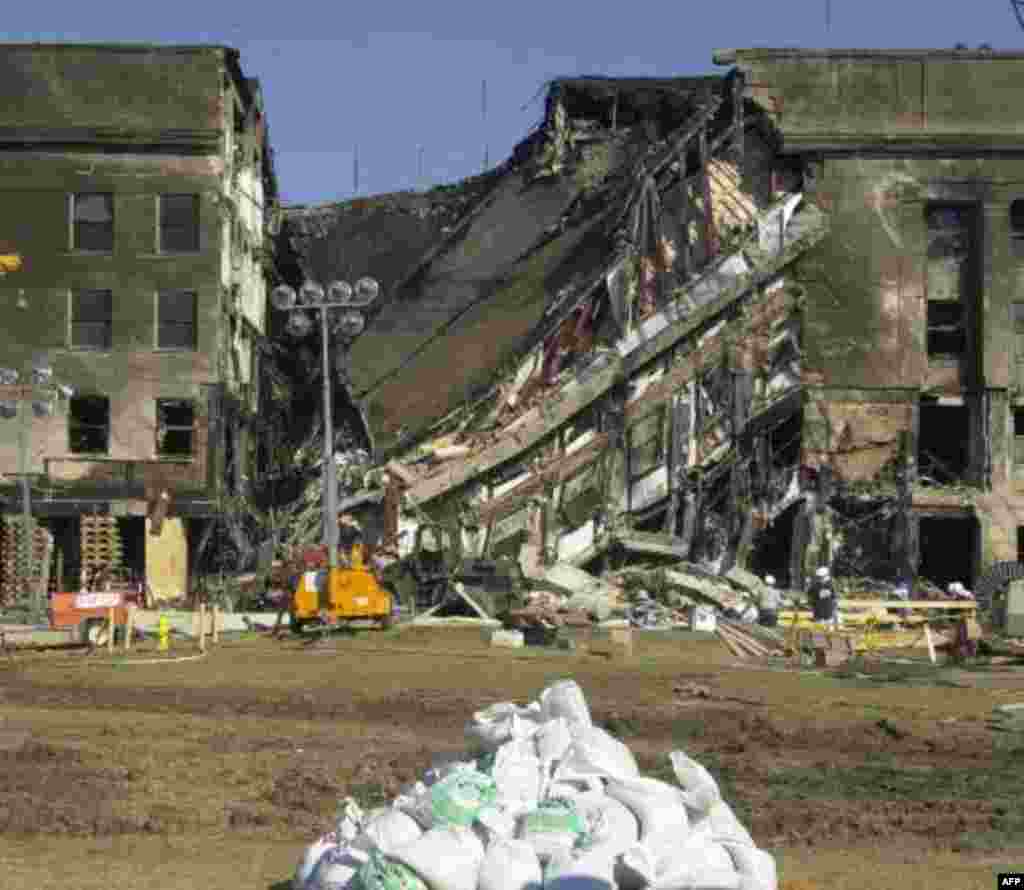 Damage to the Pentagon from Tuesday's terrorist attack is seen during a Congressional tour Thursday, Sept. 13, 2001. Searchers received a signal from the black box of the plane that crashed at the Pentagon, officials said Thursday. Search crews will not