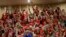 Teachers wave the hands instead of applauding as state senators debate a budget negotiated by majority Republicans and GOP Gov. Doug Ducey at the Capitol in Phoenix, May 3, 2018. 