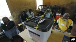 Polling staff and local observers at a polling center during the second day of the South Sudan referendum in the suburb of Khartoum, 10 Jan 2011