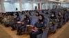 Afghan women police officers attend an event to mark International Women's Day in Kabul, Afghanistan, March 7, 2021. 