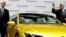 Then-Volkswagen CEO Martin Winterkorn, right, and then-Porsche CEO and member of the board of Volkswagen, Matthias Mueller, left, pose for the media beside a car prior to the company's annual press conference in Berlin, Germany, March 12, 2015.