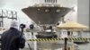 FILE - NASA’s InSight spacecraft, destined for the Elysium Planitia region in Mars’ northern hemisphere, undergoes final launch preparations at Vandenberg Air Force Base, Calif., April 6, 2018. 