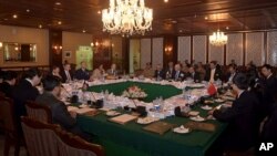 FILE - In this photo released by Associated Press of Pakistan, delegates from Pakistan, Afghanistan, China and United States attend a meeting hoping to lay the roadmap for peace talks with the Taliban, at the foreign ministry in Islamabad, Pakistan, Jan. 11, 2016. 