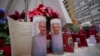 Candles with the pictures of Pope Francis are seen outside Agostino Gemelli Polyclinic in Rome, Feb. 19, 2025, where the pontiff has been hospitalized since Feb. 14.