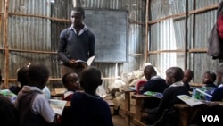 Children study at a private non-formal school, one of about 120 in the in Mathare slum, in Nairobi, Kenya, June 2, 2015. (Hilary Heuler / VOA)