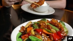 FILE- A sample of a plate of General Tso's Chicken in New York. Chef Peng Chang-kuei, the chef who has been credited with inventing world-famous Chinese food staple that is not served in China, died at age 98, on Nov. 30, 2016.