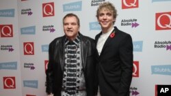 FILE - Meat Loaf (left) and Andrew Polec pose for photographers upon arrival for the Q Music Awards, at the Camden Roundhouse in London, Nov. 2, 2016. 