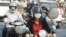 Cambodians wear masks to avoid the contact of coronavirus in Phnom Penh, Cambodia, Tuesday, Jan. 28, 2020. (AP Photo/Heng Sinith