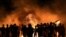 Palestinian protesters burns tires following a demonstration along the border between the Gaza Strip and Israel east of Gaza City on Aug. 28, 2021. 
