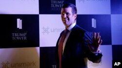 The eldest son of U.S. President Donald Trump, Donald Trump Jr. waves to media as he arrives for a meeting in Kolkata, India, Feb. 21, 2018. 