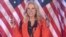 Former White House counselor Kellyanne Conway waves during a campaign event with U.S. first lady Melania Trump in Atglen, Pennsylvania.