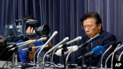 Mitsubishi President Tetsuro Aikawa listens to a reporter's question during a press conference in Tokyo, Wednesday, May 18, 2016.