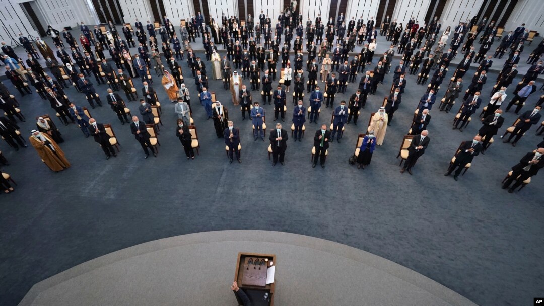 FILE - Syrian President Bashar al-Assad addresses the parliament, in Damascus, Syria, Aug. 12, 2020.