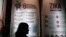 FILE - A woman passes a poster explaining about the Zika virus at the Ministry of Health office in Jakarta, Indonesia, Sept. 2, 2016. Vietnam's health ministry announced Nov. 2, 2016, a large increase of Zika cases. 