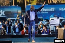 FILE - Then-Democratic U.S. Senate candidate the Rev. Raphael Warnock arrives at a campaign event ahead of Georgia's runoff elections in Savannah, Jan. 3, 2021.