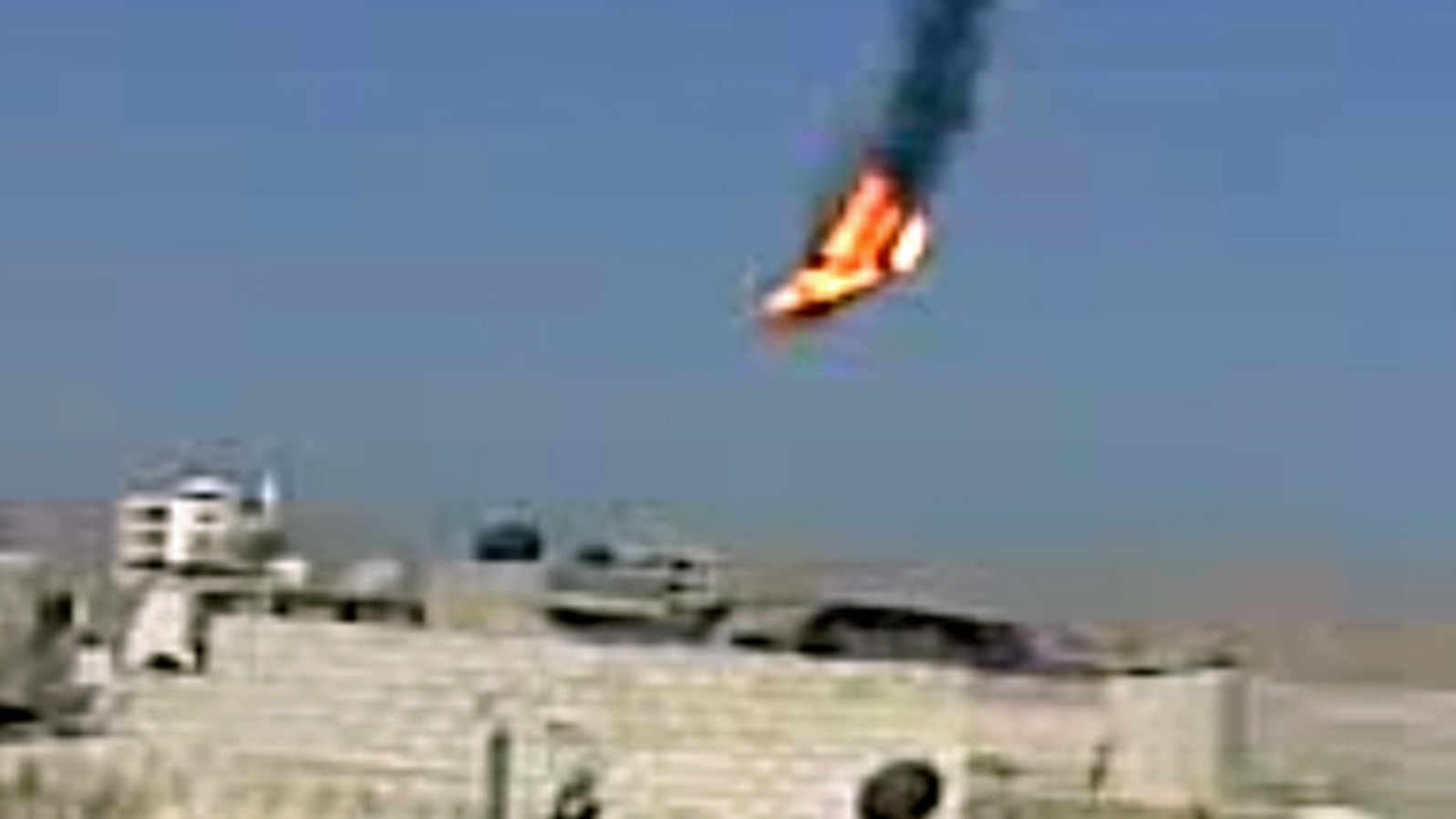 This citizen journalism image purports to show a Syrian military helicopter on fire and falling to the ground after it was apparently hit during fighting between government forces and rebels in Damascus, Aug 27, 2012. AP IS UNABLE TO INDEPENDENTLY VERIFY 