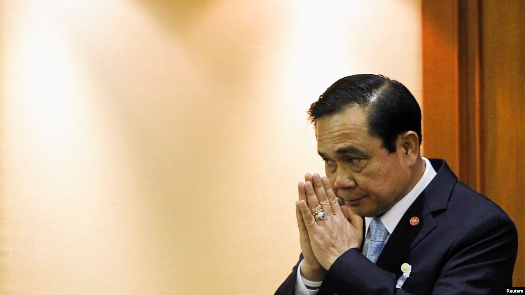 FILE - Thai Army chief General Prayuth Chan-ocha gestures in a traditional greeting during the start of a National Legislative Assembly meeting, Bangkok, August 2014.