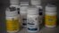 FILE - Bottles of several opioid-based medication at a pharmacy in Portsmouth, Ohio.