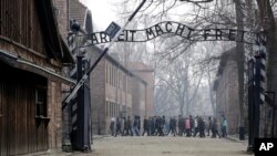 Amazon says, Dec. 2, 2019, it has removed “Christmas ornaments” and other merchandise bearing the images of Auschwitz, on its online site.