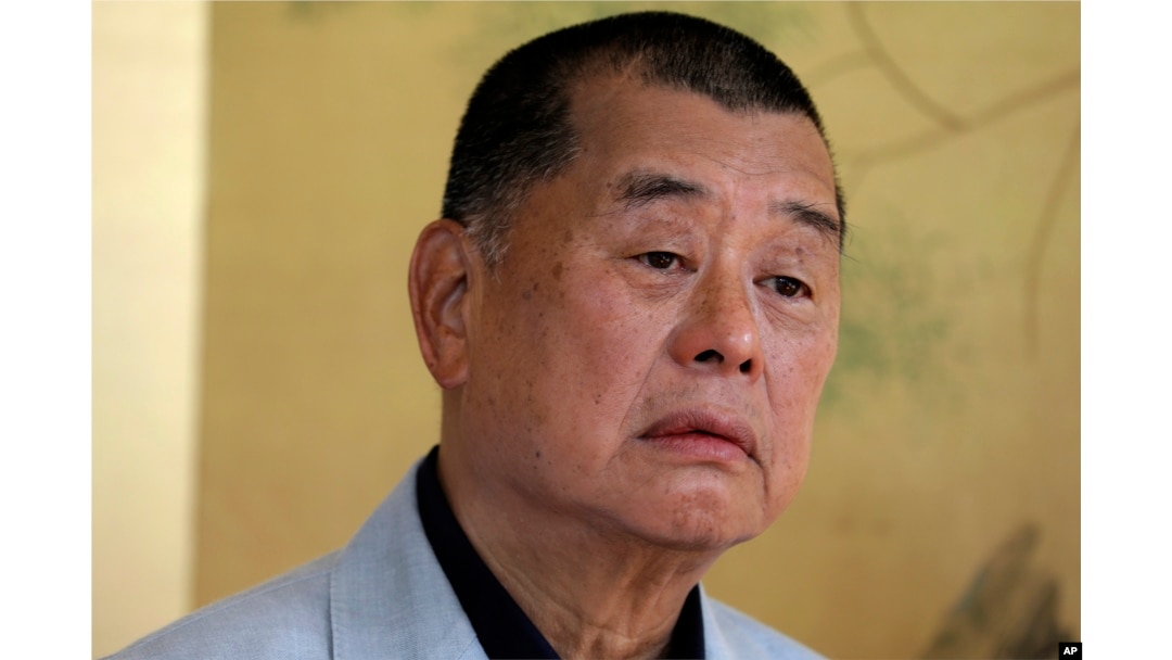 FILE - Hong Kong media tycoon Jimmy Lai pauses during an interview in Hong Kong on July 1, 2020.