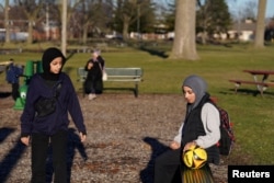 FILE - Residents play at recreation park in Dearborn, Michigan, U.S. February 4, 2024.