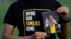 FILE - Harrison Li holds a photo of his father, Kai Li, as he poses for a photo, Tuesday, Jan. 23, 2024, in Palo Alto, Calif. 